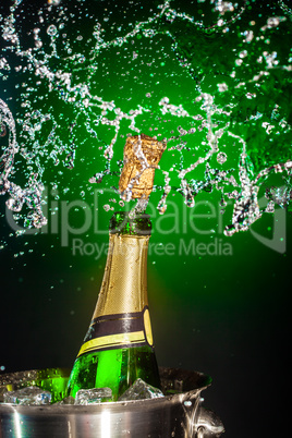Bottle of champagne with splash