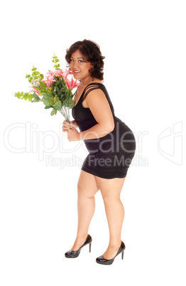 Happy mixed race woman with flowers.