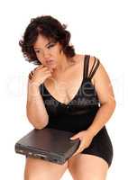 Sad woman holding broken laptop.