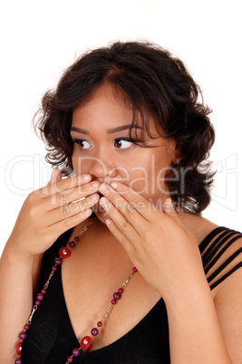 Woman holding her hand on mouth.