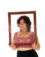 Lovely woman holding picture frame.