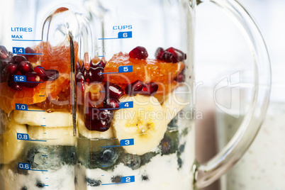 Blender with fruit and yogurt for smoothies