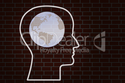 Head with earth globe on brick wall