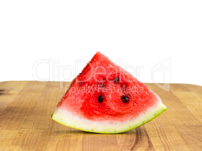 Isolated watermelon slice, cutout quarter on wooden board