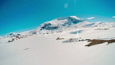 Mountain road in Norway with high snow wall