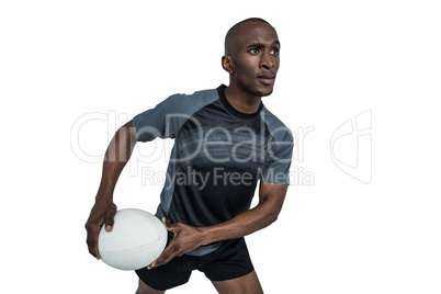 Confident athlete in position to throw rugby ball