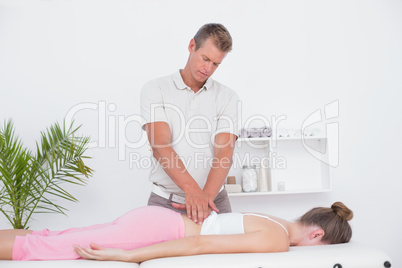 Physiotherapist doing back massage