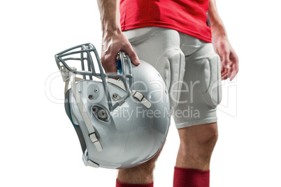 Close-up of American football player in red jersey holding helme