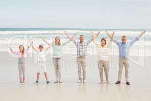 Multi generation family standing beside one another