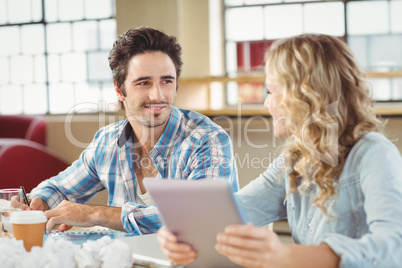 Colleagues talking about work