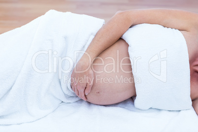 Pregnant woman touching belly