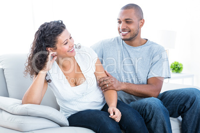 Couple enjoying on sofa