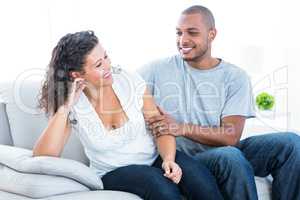 Couple enjoying on sofa