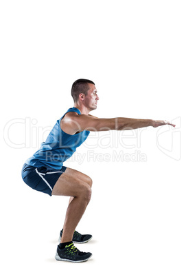 A Fit man doing squats