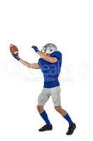American football player catching ball