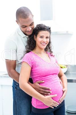 Happy pregnant woman with man