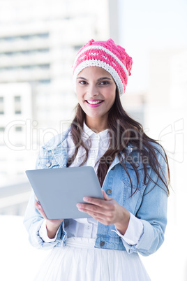 Pretty woman using her tablet pc