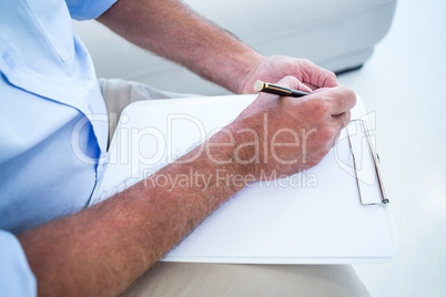 Man writing on notepad