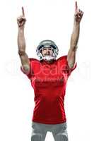American football player looking up with arms raised