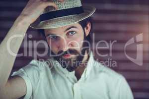 Portrait of handsome man wearing hat