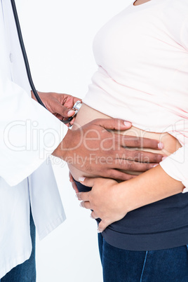 Midsection doctor checking pregnant woman