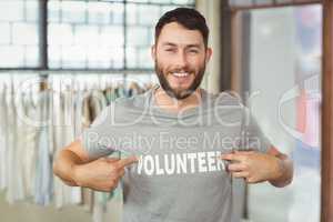 Man showing volunteer text on tshirt