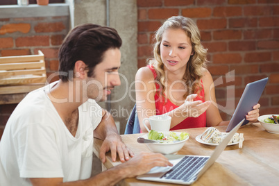 Business people discussing over table in office