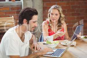 Business people discussing over table in office