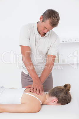 Physiotherapist doing back massage