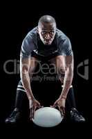 Sportsman holding ball while playing rugby