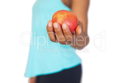 Model holding a red apple