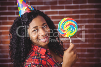 Cute model with hat and lollipop