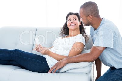 Cheerful young couple looking at each other