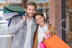 Young couple smiling while walking