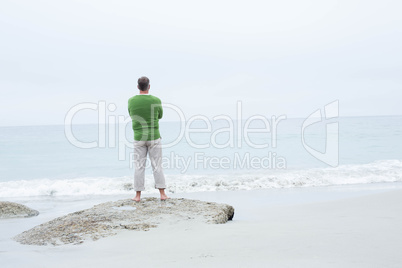 Man standing at the shoreline