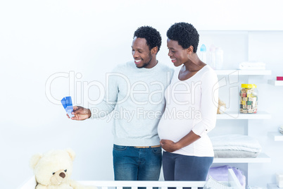 Couple looking at color swatches while standing