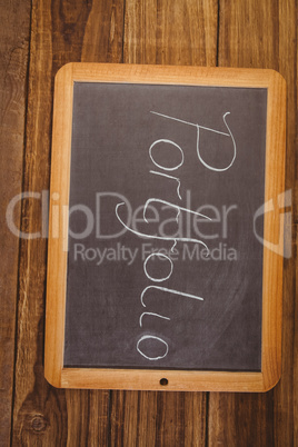 Chalkboard on table with portfolio text