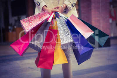 Woman showing her shopping bags