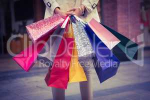 Woman showing her shopping bags