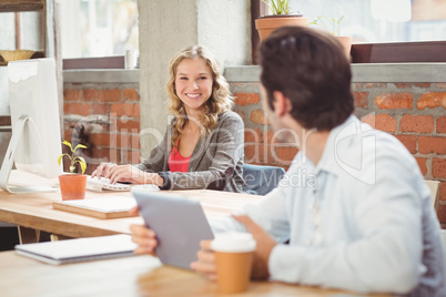 Business people discussing while working in office