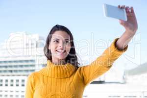 Pretty brunette taking a selfie