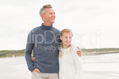 Father and daughter standing together