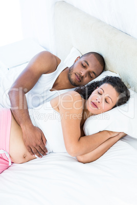 High angle view of pregnant woman with husband at home