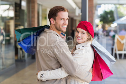 A happy couple with shopping bags