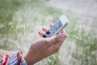 Beautiful woman using her smartphone