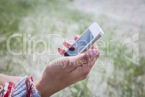 Beautiful woman using her smartphone