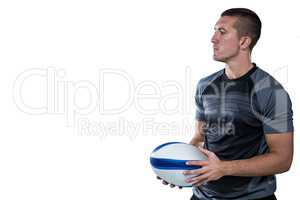 Rugby player in black jersey holding ball