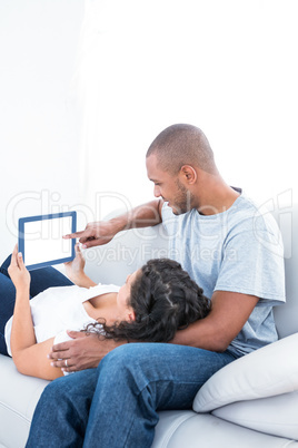 Young couple using tablet