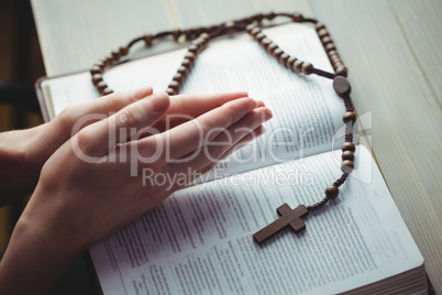 Woman praying with her bible
