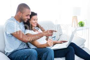 Couple enjoying online shopping